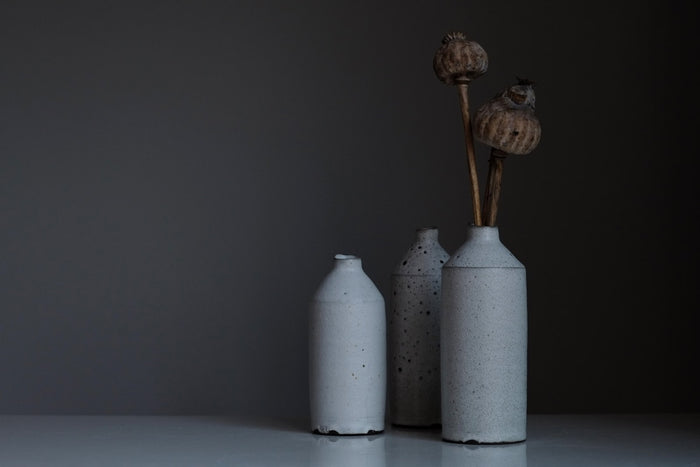 Artisan hands polishing a natural marble object to a mirror finish in a stone workshop